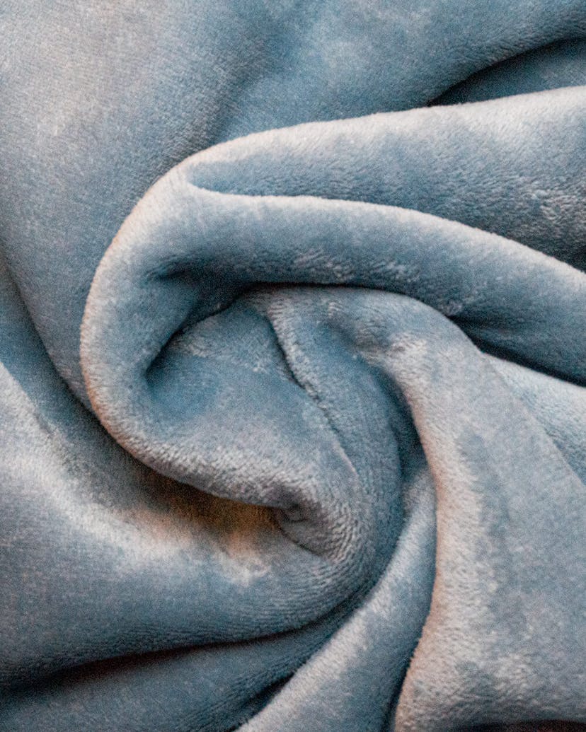A cozy blue blanket in a swirl. Perfect for snuggling up and staying warm!