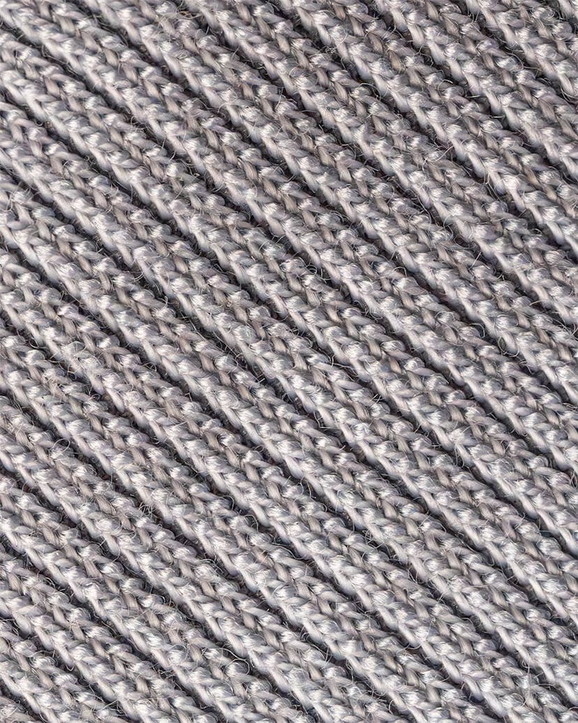A close-up of a gray knitted fabric, perfect cozy hoodie material